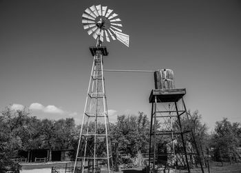 Low angle view of traditional windmill against sky