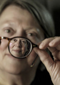 Face of an elderly person caught in a one glass