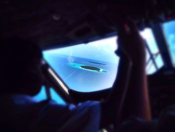 View of island through airplane window