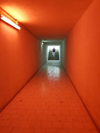Man walking in illuminated building