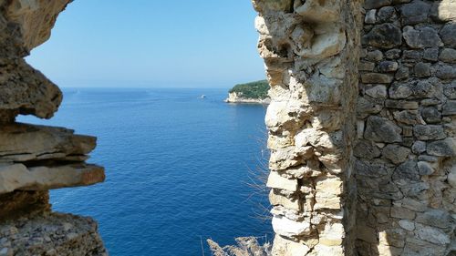 Scenic view of sea against blue sky