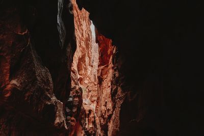 From below of rough rocky formations in sandstone ravine in wadi rum at daytime