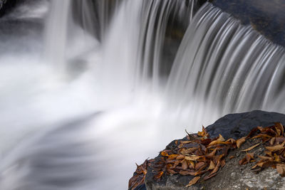 Close-up of waterfall against rocks