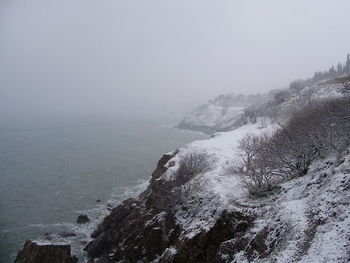 Scenic view of sea against clear sky during winter