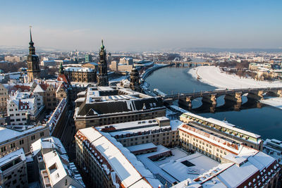 High angle view of cityscape by elbe river during winter