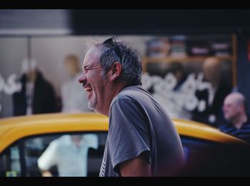 Portrait of man sitting in car