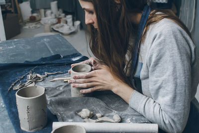 Close-up of woman working at table