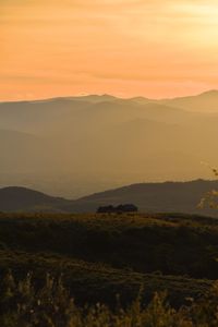 Scenic view of landscape against sky during sunset