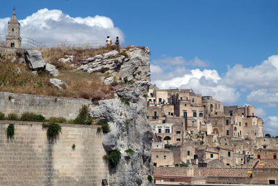 Buildings in town against sky