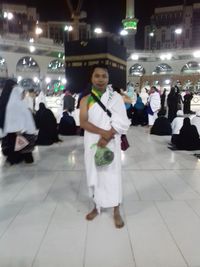 Portrait of people standing on street in city