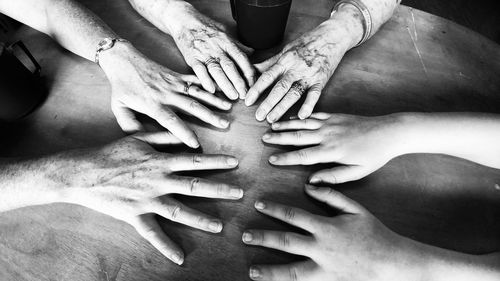 Close-up of hands touching water