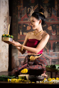 Young woman sitting in temple