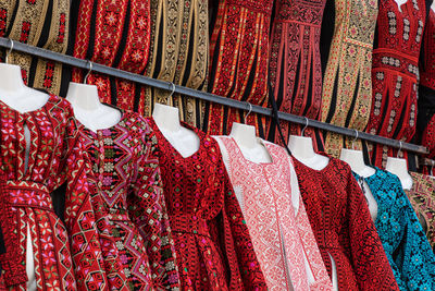 Clothes hanging in store for sale at market stall