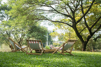 Empty chairs in park