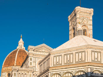 Low angle view of building against blue sky