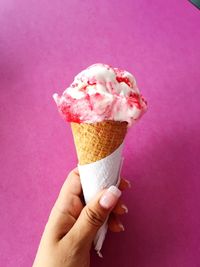 Close-up of hand holding ice cream