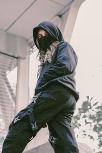 Portrait of young woman standing outdoors