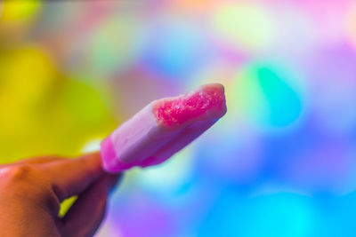 Close-up of hand holding ice cream