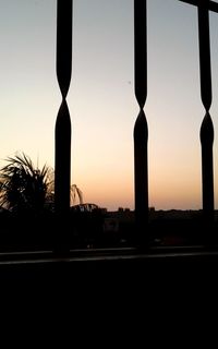 Silhouette built structure against sky during sunset