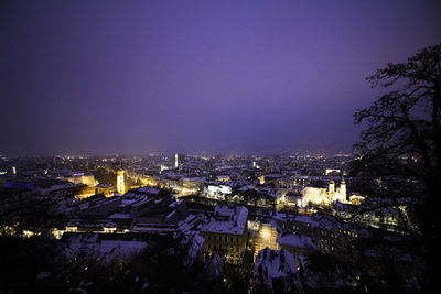 High angle view of illuminated buildings at night