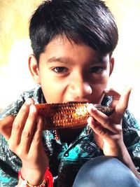 Portrait of boy eating food