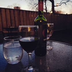 Glass of bottle on table