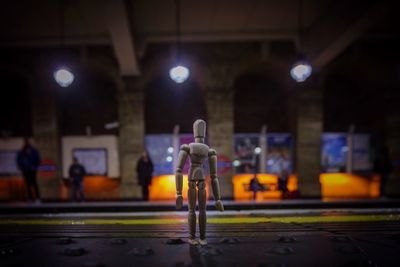 Close-up of figurine on railroad station platform