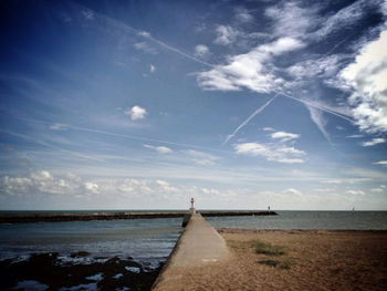 Scenic view of sea against cloudy sky