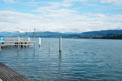 Pier over sea against sky