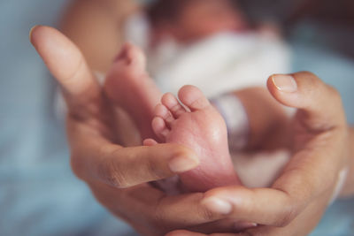 Cropped image of couple holding hands