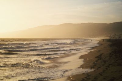 Scenic view of beach against clear sky