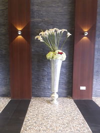 Flower vase on table