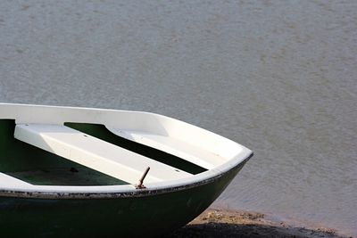 Rowboat moored at lakeshore