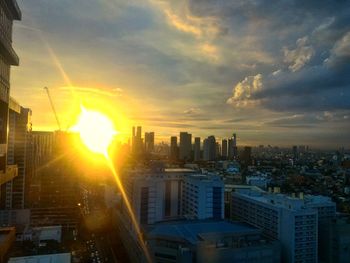 Cityscape against sky during sunset