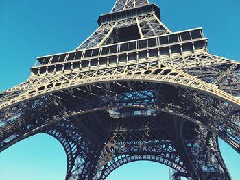 Low angle view of tower against blue sky