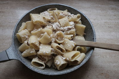 High angle view of pasta in saucepan on table