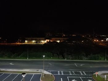 View of illuminated road at night