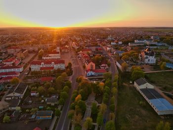 High angle shot of townscape against sky at sunset