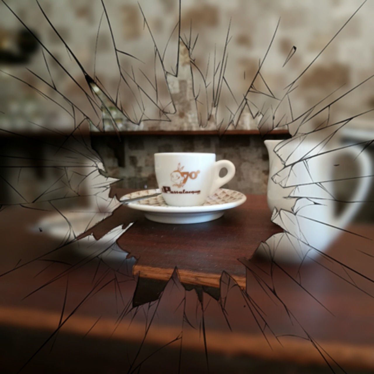 CLOSE-UP OF COFFEE CUP ON TABLE WITH SPOON