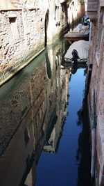 Reflection of sky in puddle