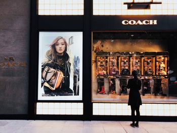 Full length of woman standing in store