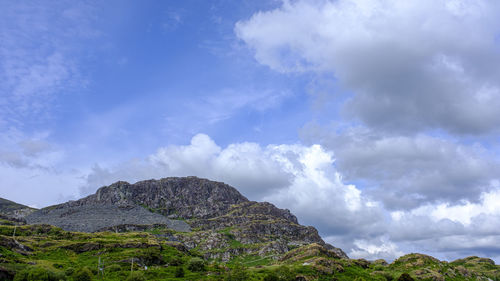 Low angle view of rocks against sky