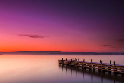 Silhouette of pier at dusk