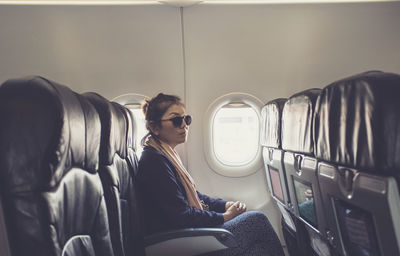 Woman sitting in airplane