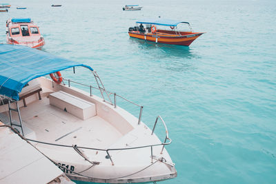 Boat sailing in sea against sky