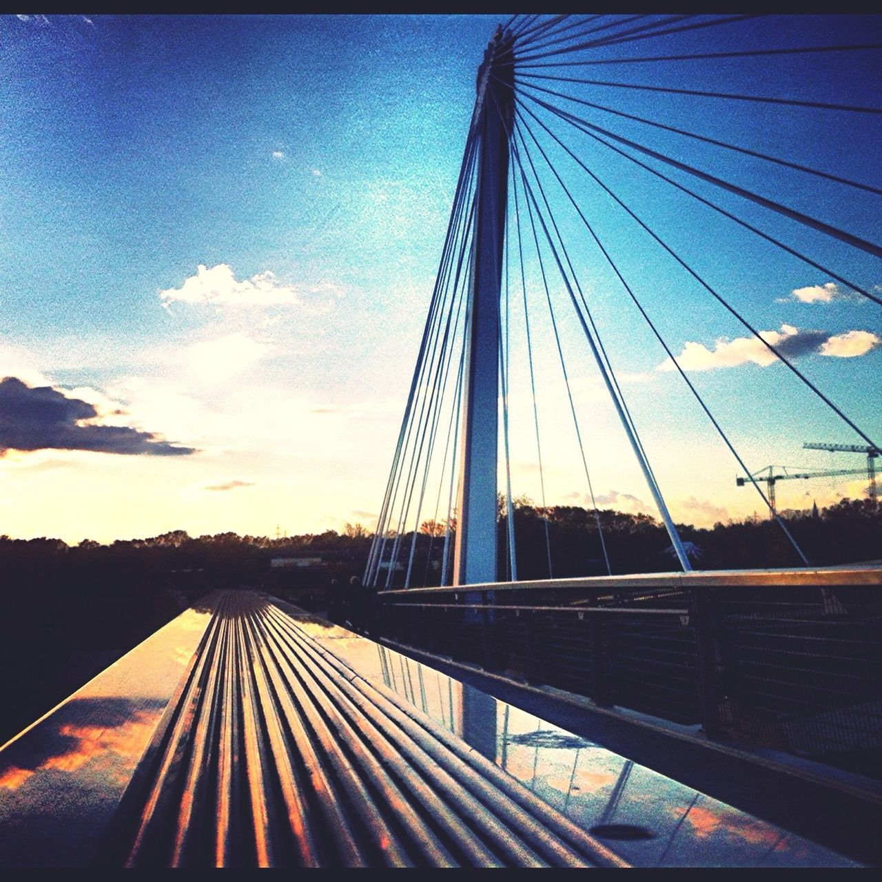 connection, the way forward, built structure, transportation, bridge - man made structure, sky, diminishing perspective, architecture, railing, vanishing point, metal, engineering, long, bridge, blue, sunlight, cloud, no people, cloud - sky, railroad track