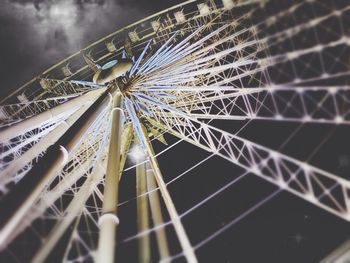 Low angle view of ferris wheel against sky