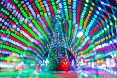 Multi colored light trails at amusement park