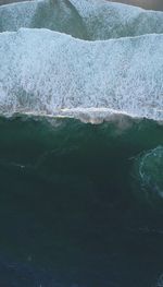 Close-up of ice on sea shore