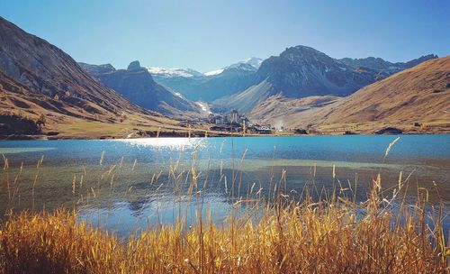 Scenic view of lake and mountains against sky